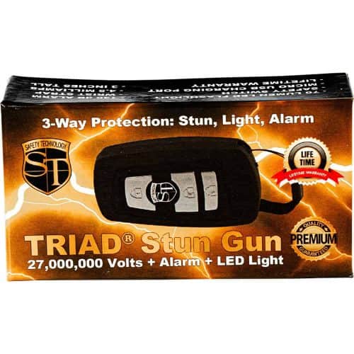 TRIAD Stun Gun box with 27 million volts, alarm, and LED light featuring 3-way protection and lifetime warranty.