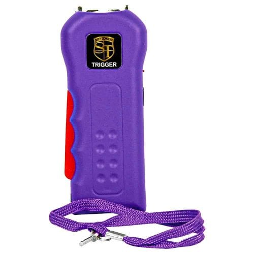 Purple stun gun with safety switch and wrist strap for personal protection.